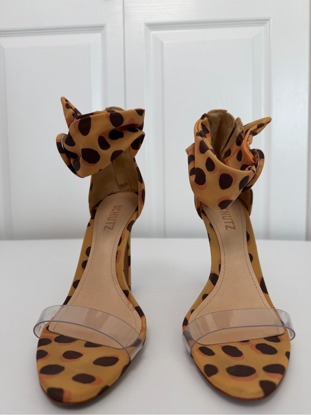 SCHUTZ Leopard-Print Bow Ankle-Strap Heels in Tan and Brown
